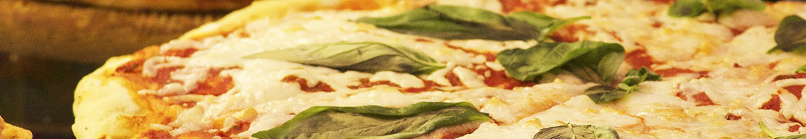 Eating Italian Pizza at Portofino's Greek and Italian Restaurant restaurant in East Ridge, TN.